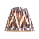 Endon Bevford tapered pleated fabric shade in pearl grey zigzag faux silk with taped edging, shown lit on a plain white background.