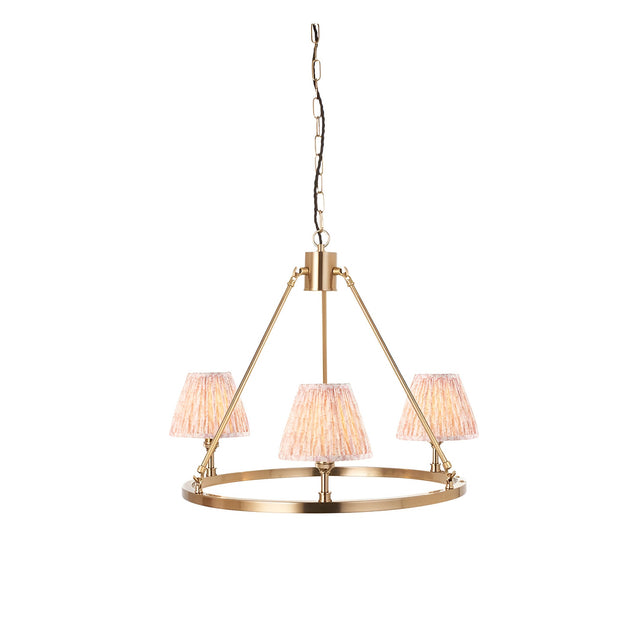 Endon Bevford 3 light pendant with an aged brass hoop, chain suspension and three pleated peach faux linen tapered shades on a white background.