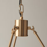 Close-up of the Endon Bevford 3 Light Pendant showing the aged brass cylindrical hub, chain link, black fabric flex and tapered arm fittings.