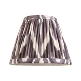 Endon Bevford tapered pleated wall light shade in pearl grey faux silk with zigzag print and taped edging, shown on a plain white background.