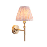 Bevford Leaf Wall Light in aged brass finish with pleated pink leaf-pattern fabric shade, on a plain white background.