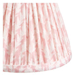 Close-up of the Bevford Leaf Wall Light's pleated pink and white faux linen shade, showing leaf-patterned fabric and taped edge detailing.
