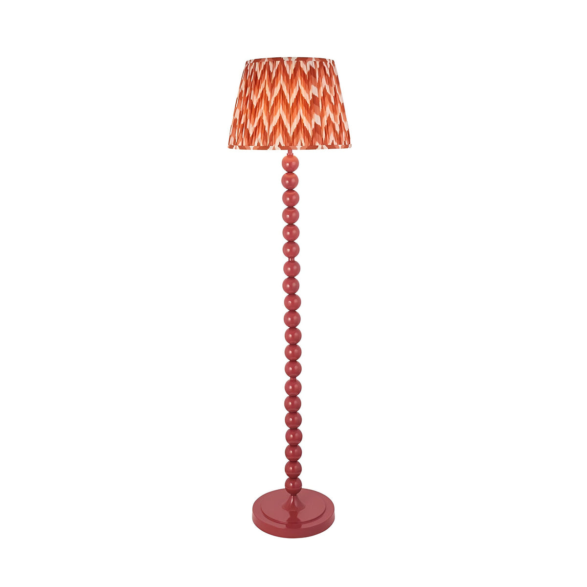 Brenleigh Zigzag Floor Lamp with a stacked pink gloss metal sphere column and a pleated apricot-orange zigzag fabric shade, on a plain white background.