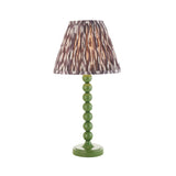 Brenleigh Ikat table lamp with a green gloss stacked-sphere metal base and pleated grey Ikat fabric shade, shown on a plain white background.