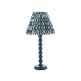 Brenleigh Ripple Table Lamp in blue, gloss stacked-sphere metal base with a pleated 25cm ripple-print fabric shade, on a plain white background.
