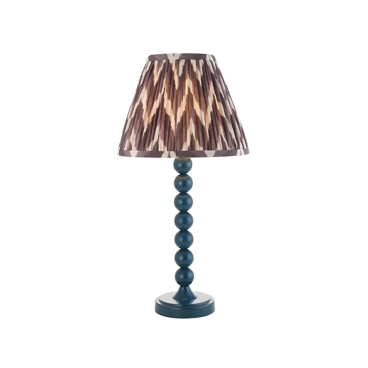 Endon Brenleigh table lamp with a blue gloss stacked-sphere metal base and grey zigzag pleated faux silk shade, on a plain white background.