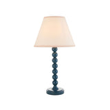 Brenleigh Ivy table lamp with a stacked-sphere blue metal base and white cotton-mix Ivy shade, shown on a plain white background.