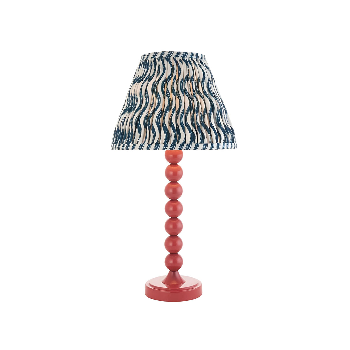 Endon Brenleigh Ripple table lamp with stacked-sphere pink gloss metal base and pleated blue ripple-print fabric shade on a plain white background.