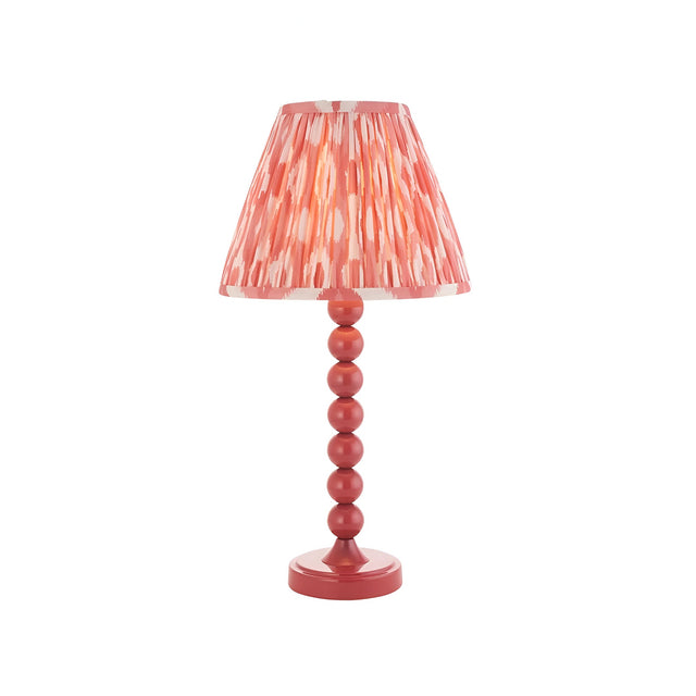 Endon Brenleigh Ikat table lamp in pink with a stacked-sphere gloss metal base and pleated Ikat faux silk shade, on a plain white background.