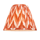 Brenleigh Zigzag Table Lamp shade in pleated orange and white zigzag faux silk with matching trim, shown on a plain white background.