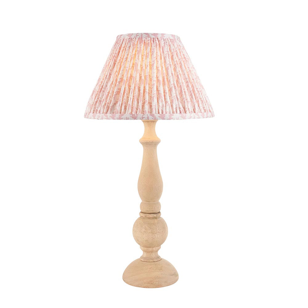 Brenhurst Table Lamp with hand-turned natural wood base and pleated pink Leaf-print fabric shade, brass B22 bulb holder, on a plain white background.