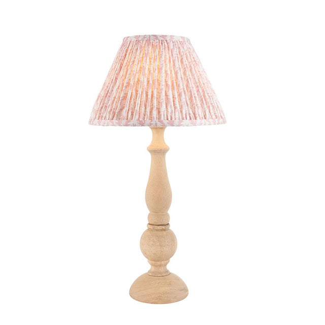 Brenhurst Table Lamp with hand-turned natural wood base and pleated pink Leaf-print fabric shade, brass B22 bulb holder, on a plain white background.