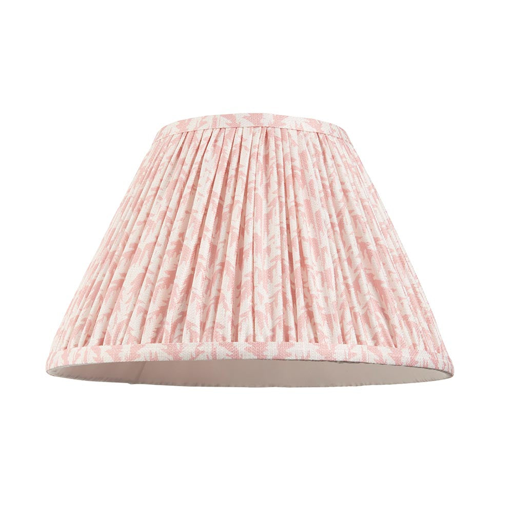 Pleated pink and white patterned fabric lamp shade shown alone on a plain white background, with brass fitting visible inside.