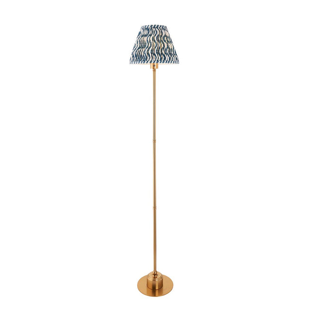 Endon Ashstead LED floor lamp with a slim brushed brass stem and blue and white ripple-print pleated fabric shade, shown on a plain white background.