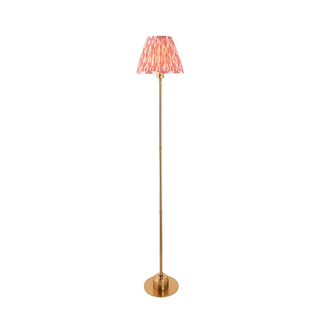 Endon Ashstead LED floor lamp with slim brushed brass stem and pleated pink Ikat fabric shade, shown on a plain white background.