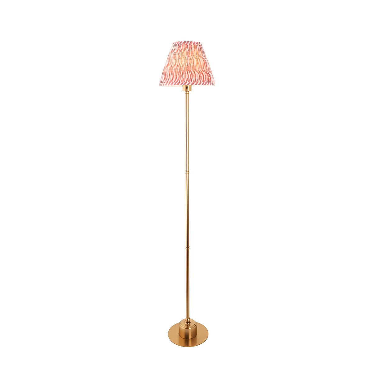 Endon Ashstead LED Ripple floor lamp with brushed aged brass stem and coral pink pleated fabric shade, shown on a plain white background.