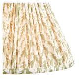 Close-up of the Endon Ashstead floor lamp's 30cm Leaf shade, a gathered pleat fabric in herb green print with taped edging on a plain background.