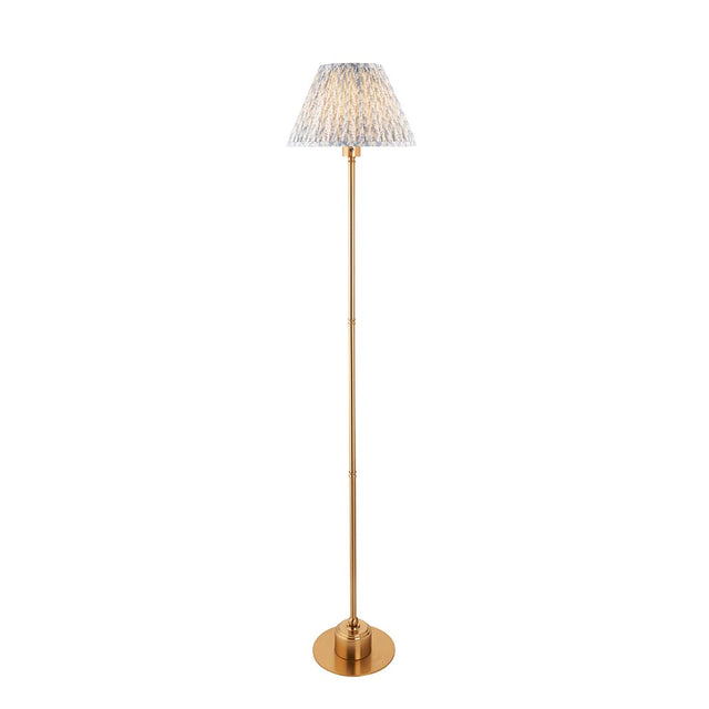 Ashstead LED Leaf Floor Lamp with slim brushed brass stem and pleated white and blue leaf-print fabric shade, on a plain white background.