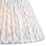 Close-up of the Ashstead LED Floor Lamp's pleated fabric shade in a leaf print pattern with blue and white tones and taped edge trim.