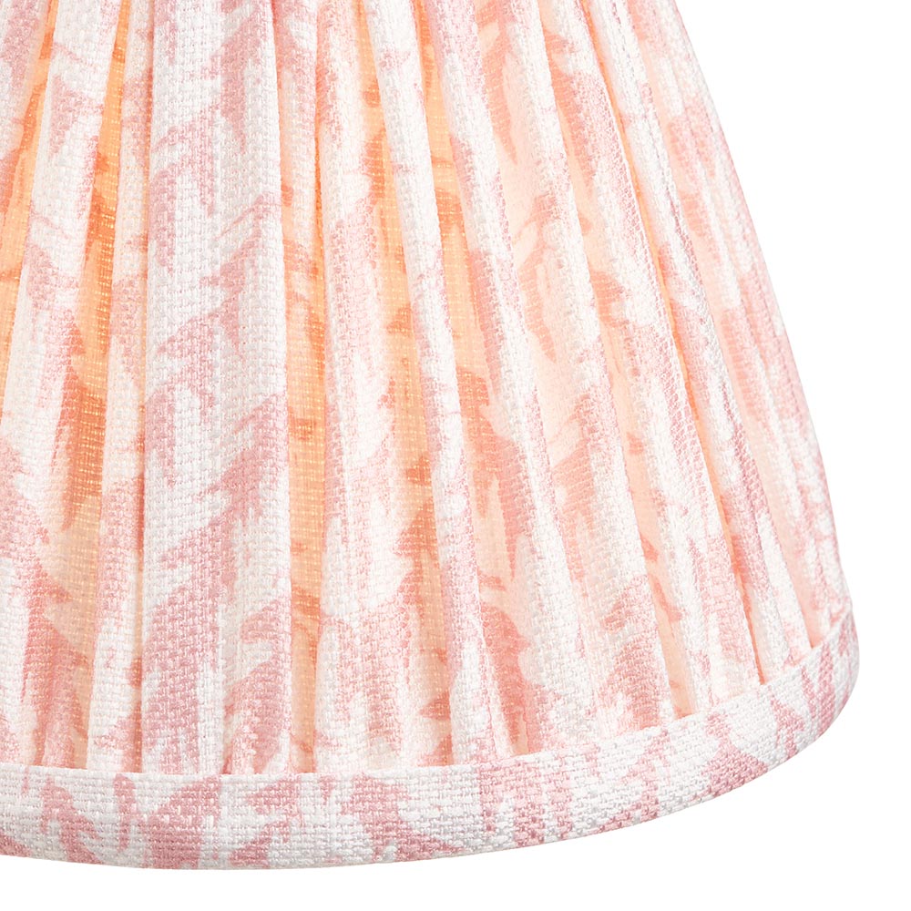 Close-up of the Endon Ashstead LED table lamp's hand-pleated shade in digitally printed faux linen with a soft peach leaf motif on white.