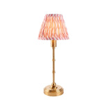 Endon Ashstead LED cordless table lamp with brushed brass stem and pleated pink and white ripple-print fabric shade, shown on a plain background.