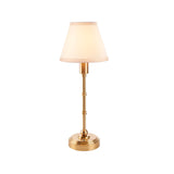 Ashstead LED Table Lamp in brushed aged brass with a tapered vintage white cotton-mix shade, on a plain white background.