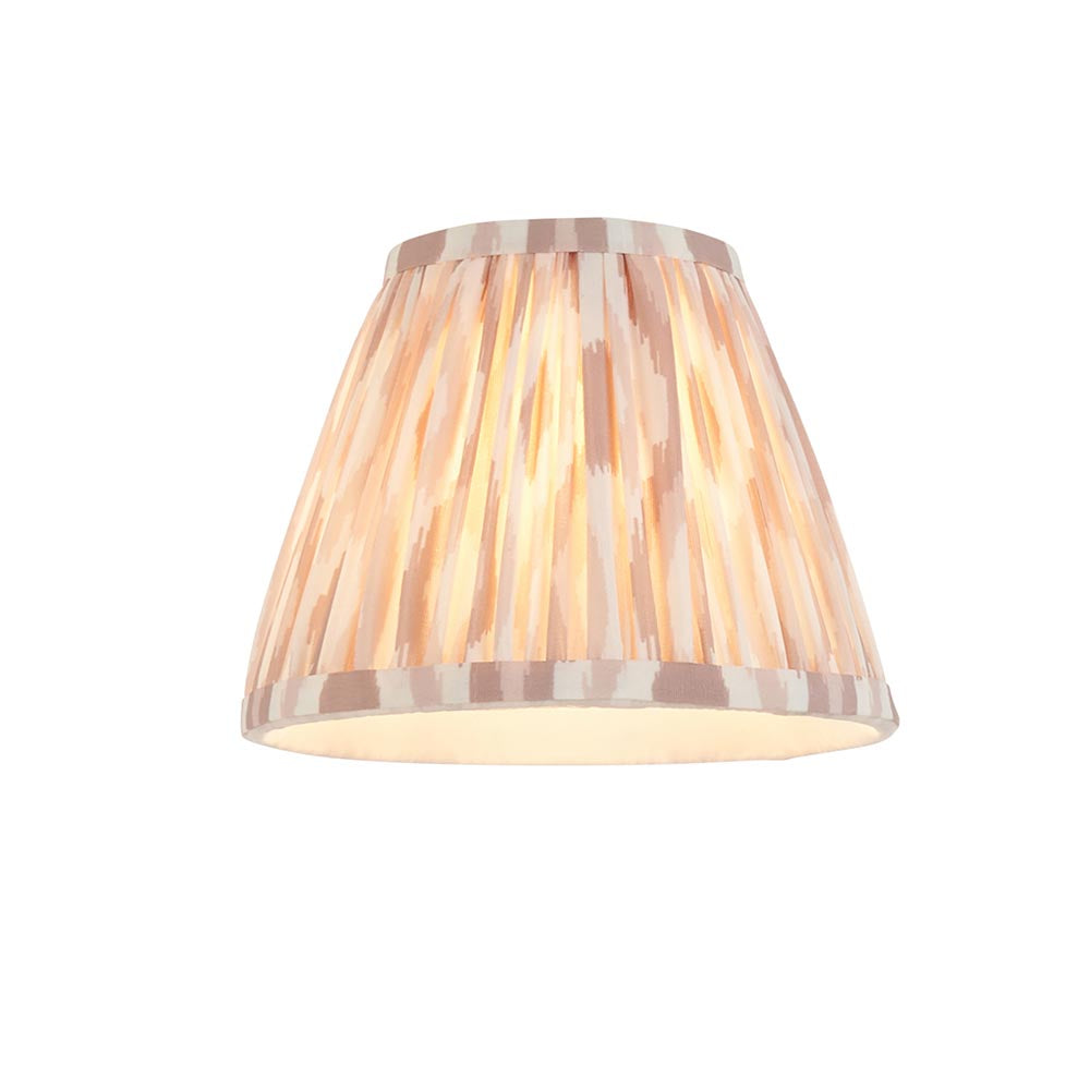 Endon Ashstead handmade pleated Ikat clip-on lamp shade in white and natural with brushed brass trim, shown lit on a plain white background.