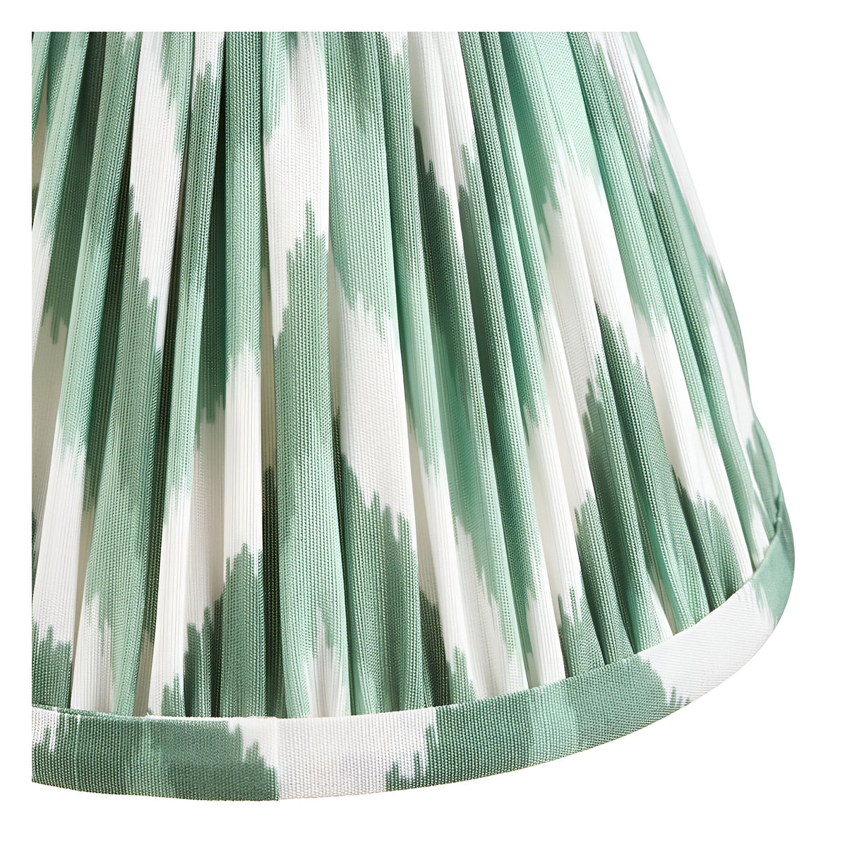 Close-up of the Endon Ashstead LED wall light's pleated zigzag shade in green and white faux silk, showing the fabric detail and trimmed lower edge.