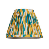 Endon Ashstead pleated Ikat lamp shade in white with yellow and jade blue brushstroke print, shown on a plain white background.
