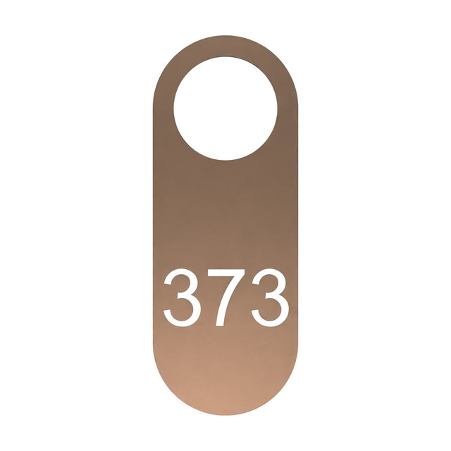 Blink signage tag for wall light in copper-finish iron plate, rounded shape with a round opening at the top and "373" cut through the surface, shown on a plain white background.