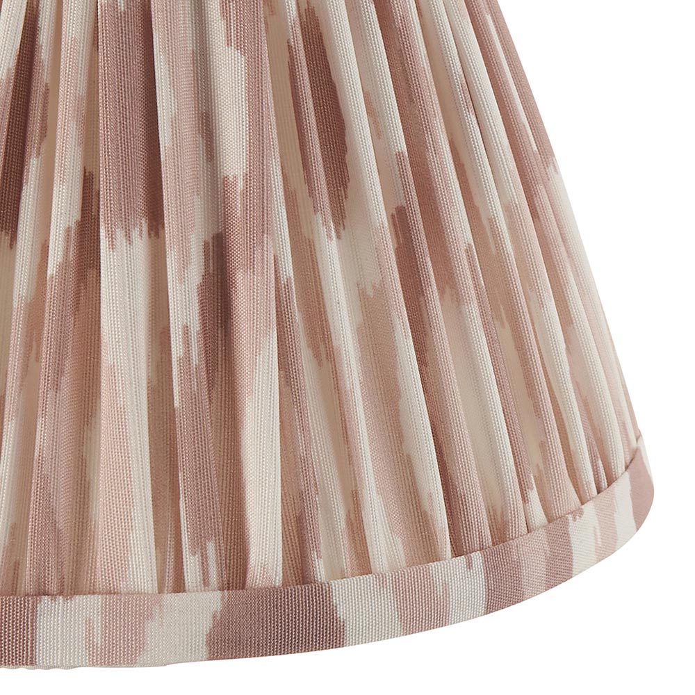 Close-up of the Endon Ashstead LED wall light's pleated Ikat shade in natural and white brushstroke print, trimmed at the lower edge.