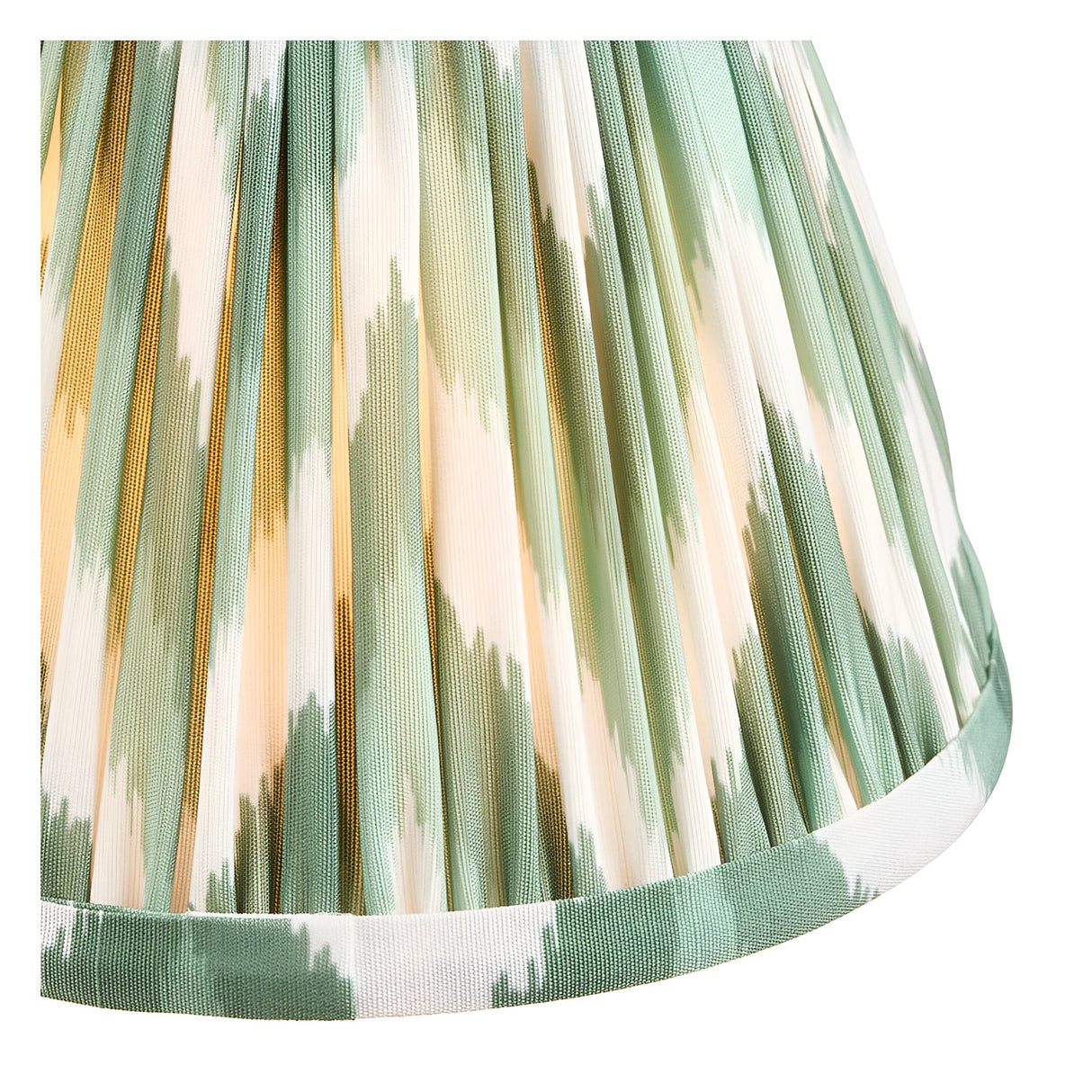 Close-up of the Carlwood LED Table Lamp's pleated Zigzag shade in Cotswold green, showing gathered faux silk fabric with a green and white patterned taped edge.
