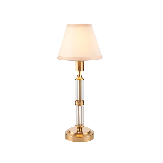 Endon Carlwood LED rechargeable table lamp in brushed brass with clear acrylic column and tapered vintage white fabric shade, on a plain background.