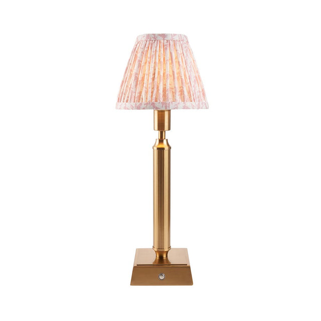 Cranwick LED table lamp with reeded brass stem, square base, touch control, and pleated leaf-print fabric shade on a plain white background.
