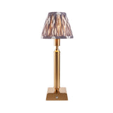 Endon Cranwick LED Ikat table lamp with brushed brass reeded stem, square base and grey and white patterned clip-on shade on a white background.