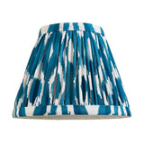 Cranwick LED Ikat Table Lamp shade in pleated blue and white patterned fabric, shown on a plain white background.