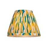 Cranwick LED Ikat table lamp shade in yellow, teal and white patterned fabric, shown on a plain white background.
