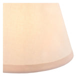 Close-up of the Endon Cranwick table lamp's tapered Ivy shade in vintage white cotton-mix fabric with almond white taped edge, illuminated softly.