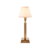 Endon Cranwick LED rechargeable table lamp with a reeded brushed brass stem, square base, and tapered ivy white fabric shade on a plain background.