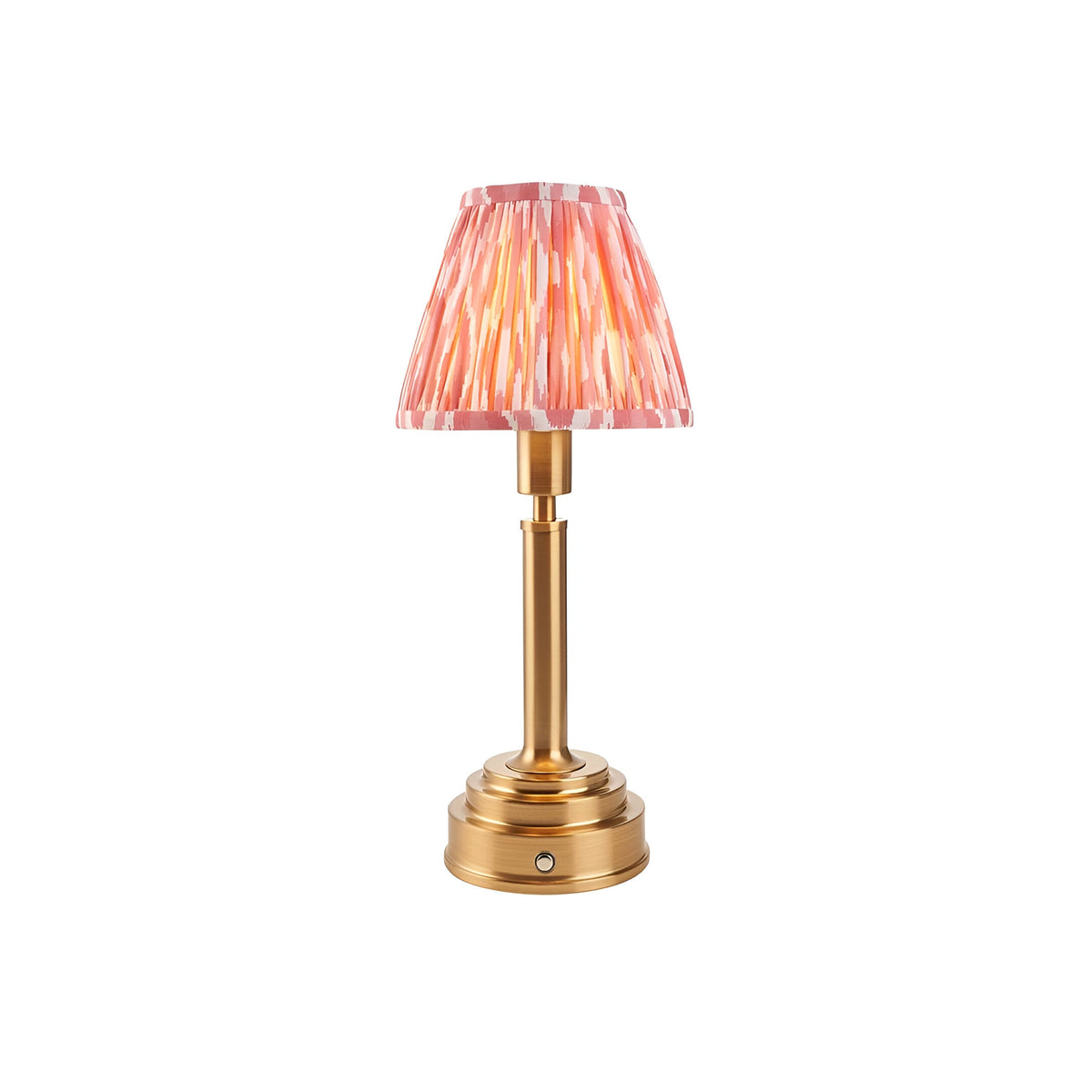 Endon Danebourne LED table lamp with brushed brass stepped base and pink and white Ikat pleated clip-on shade, on a plain white background.