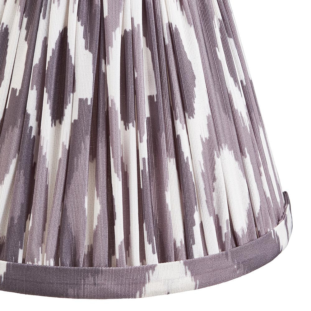 Close-up of the Endon Danebourne LED Ikat table lamp shade in pleated faux silk with a grey and white ikat pattern.