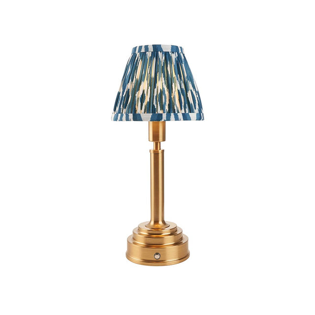 Danebourne LED Ikat table lamp with brass stepped base, fabric pleated shade in blue and white patterned print, on a plain white background.