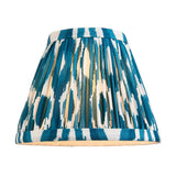 Danebourne LED Ikat Table Lamp pleated fabric shade in blue and white patterned print, shown lit against a plain white background.
