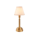 Danebourne LED rechargeable table lamp with a tapered white fabric shade on a stepped brushed brass base with touch dimmer, shown on a plain white background.