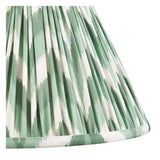 Close-up of the Endon Carlworth table lamp's gathered pleated shade in green and white zigzag Cotswold-print faux silk.
