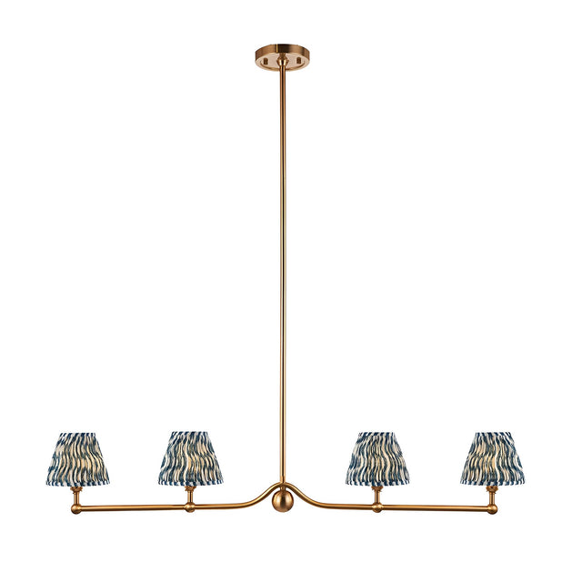 Cliffleigh 4 Light Ripple Pendant in brushed aged brass with a linear bar and four tapered blue patterned fabric shades, shown on a plain white background.