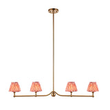 Endon Cliffleigh 4 light linear pendant in brushed aged brass with four coral pink pleated faux silk taper shades, shown on a white background.
