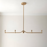 Endon Cliffleigh Leaf 4 light linear pendant in brushed aged brass with slim bar, central sphere detail and four bayonet lamp holders, shown without shades.