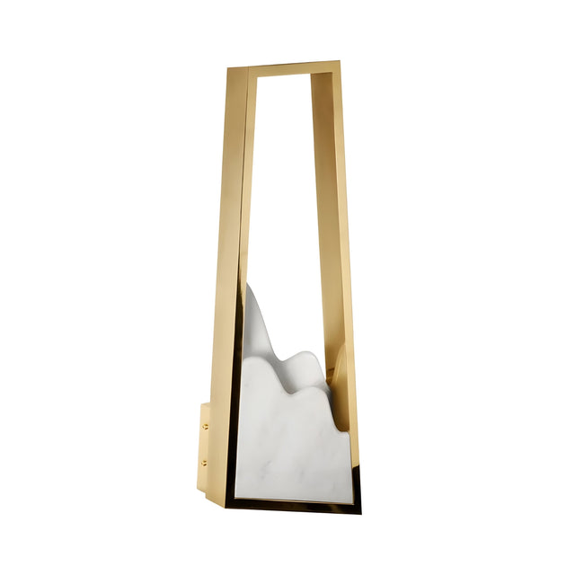 The Atria LED Left Alabaster Wall Light features a tall, brushed brass frame with an abstract white alabaster shape reminiscent of mountain peaks inside.