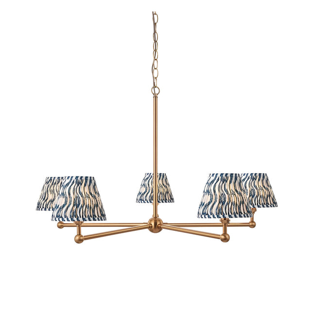 Cliffleigh 5-Light Ripple Pendant in Blue with tapered wavy blue-and-cream fabric shades on a brushed brass frame with chain suspension.